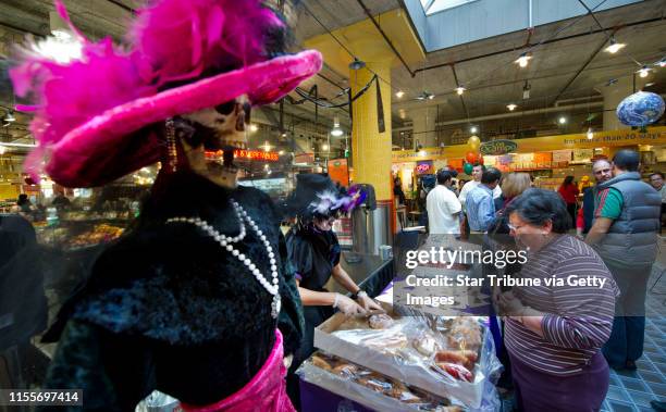 Dbrewster@startribune.com Sunday 11/07/10 Minneapolis taste of mexcico festival - maybe day of the dead theme? ] Sunday was the Day of the Dead, a...