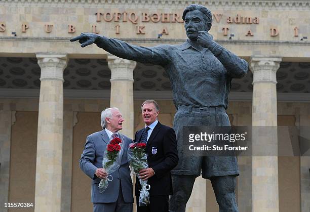 Former West Germany goalkeeper Hans Tilkowski and former England striker Sir Geoff Hurst stand next to the statue of the 1966 World Cup final...