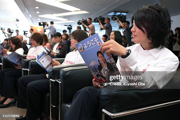 Japan Women's National Soccer Team player Yuki Nagasato looks at a brochure during a welcome event as part of the FIFA Women's World Cup Germany 2011...