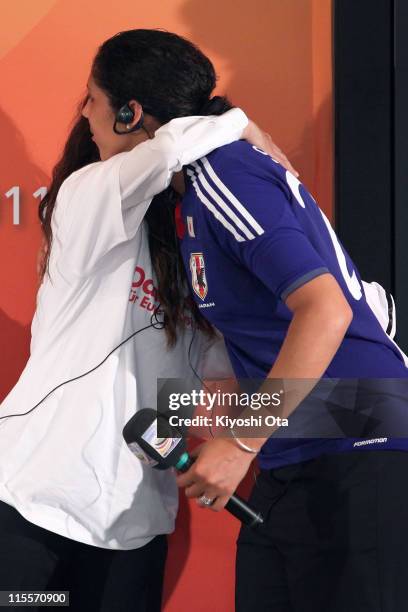 Japan Women's National Soccer Team player Homare Sawa hugs Steffi Jones, President of the Women's World Cup 2011 German Organizing Committee, as she...