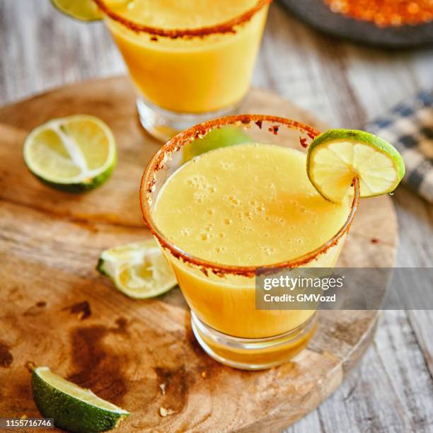 chili lime mango margaritas - margarita stock pictures, royalty-free photos & images