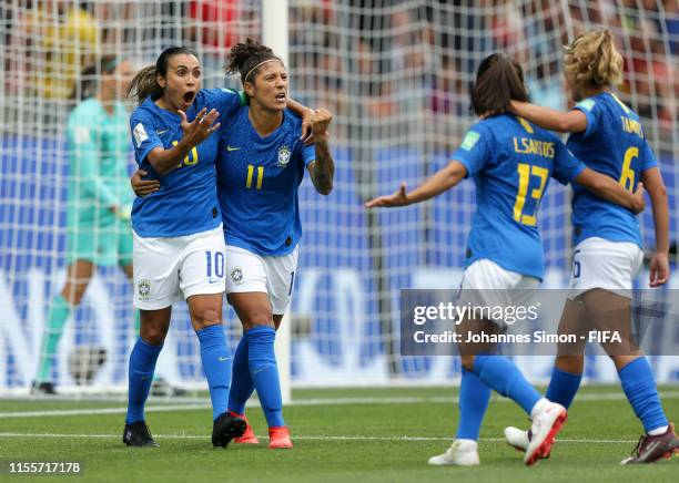 Cristiane of Brazil celebrates with teammate Marta after scoring her team's second goal during the 2019 FIFA Women's World Cup France group C match...
