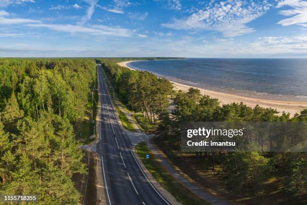 road along the baltic sea - aerial view - latvia stock pictures, royalty-free photos & images
