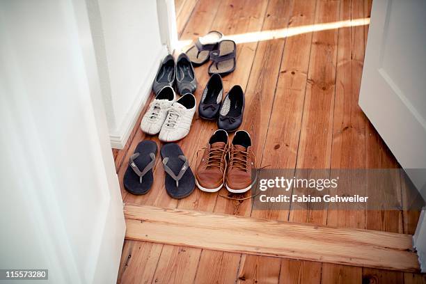 shoes in hallway - slipper stock pictures, royalty-free photos & images