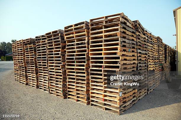 stack of wooden pallets - pallet stock pictures, royalty-free photos & images