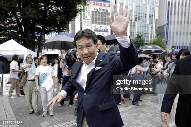 Yukio Edano, head of the Constitutional Democratic Party of Japan, waves as he leaves an election campaign rally in Tokyo, Japan, on Monday, July 15,...