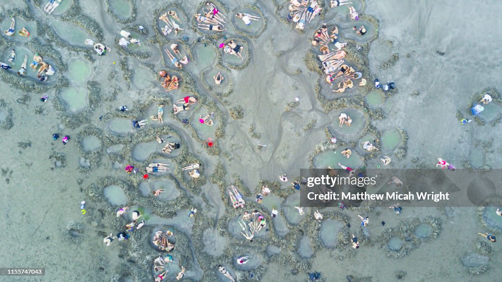 New Zealand's famed Hot Water Beach is a must stop for many after leaving Auckland. Holes are dug into the beach and hot geothermal water creats natural spa pools.