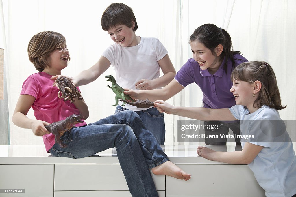 Children playing with Dinosaurs