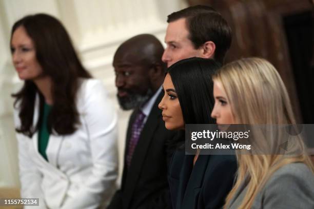 Kim Kardashian West sits with Ivanka Trump and Jared Kushner during an East Room event on “second chance hiring” June 13, 2019 at the White House in...