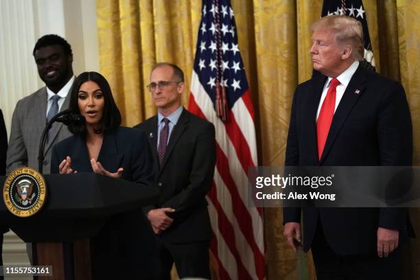 Kim Kardashian West speaks as U.S. President Donald Trump listens during an East Room event on “second chance hiring” June 13, 2019 at the White...