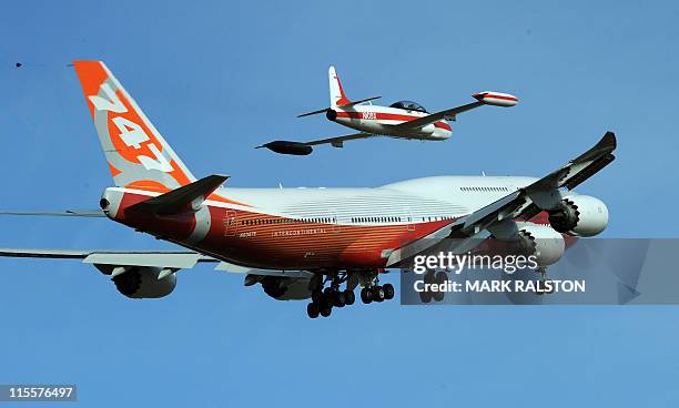 The 747-8 Intercontinental, Boeing's largest-ever passenger airplane, takes off for the first time from Paine Field in Everett, Washington state on...