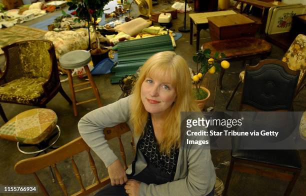 Joey McLeister/Star Tribune St. Paul, Mn.,Weds.,July 21, 2004--Eve Cauley, the set designer for "Factotum", sits among the furnishings and odds and...