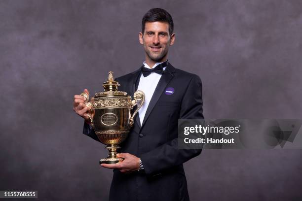 In this handout image supplied by the All England Lawn Tennis Club, Novak Djokovic of Serbia, the Gentlemens Singles champion photographed at the...