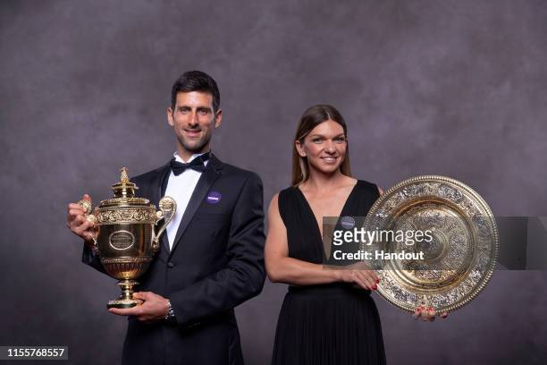 In this handout image supplied by the All England Lawn Tennis Club, Simona Halep of Romania and Novak Djokovic of Serbia, the Ladies Singles and...