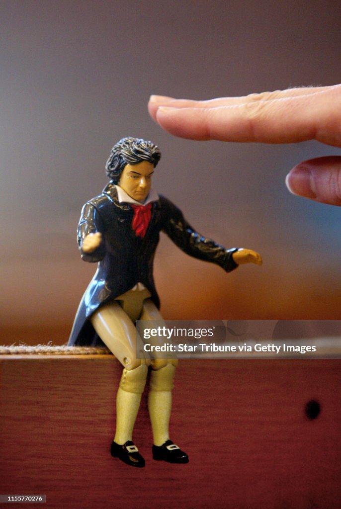 2/4/2005 Minneapolis, MN.-- for good luck in the Music Listening Contest that had 17 high school teams competing Watertown High School students brought Beethoven and Mozart figures with them, they sat them on the seats in front of them and patted their he