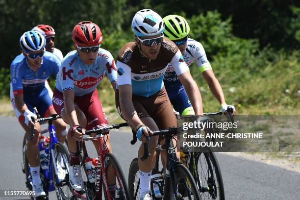 France's Tony Gallopin , Norway's Odd Christian Eiking , Denmark's Mads Schmidt , France's Anthony Turgis and Eritrea's Natnael Berhane ride in a...