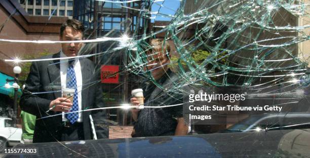 Bruce Bisping/Star Tribune. St. Paul, MN., Monday, 5/23/2005. Downtown St. Paul pedestrians walked by a crashed car where people hit the windshield...