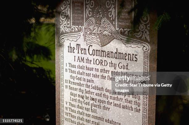 David Brewster/Star Tribune Monday_06/27/05_AlbertLea - - - - The Ten Commandments monument erected in 1956 at Albert Lea's Central Park, sits...
