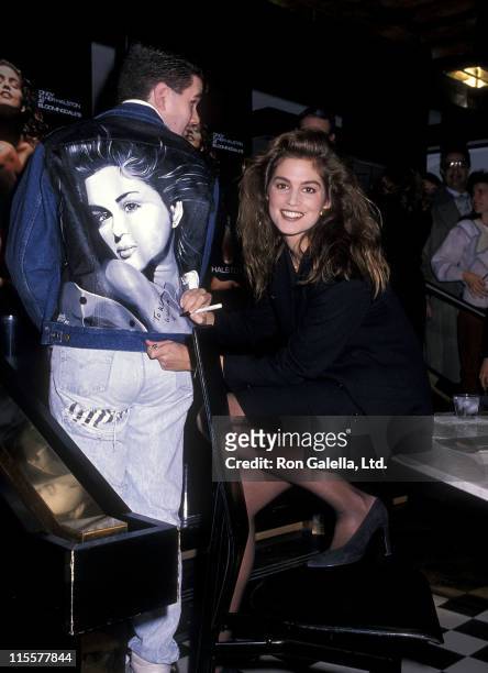 Model Cindy Crawford promotes Halston's new fragrance on February 26, 1990 at Bloomingdale's in New York City.