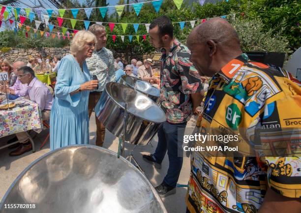 Camilla, Duchess of Cornwall, patron of 'The Big Lunch' talks to members of a steel band during the tenth anniversary celebration of the initiative...