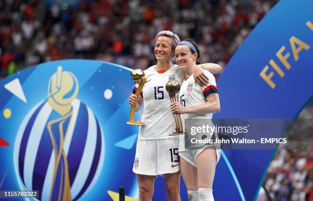 S Megan Rapinoe and Rose Lavelle celebrate with their gold and bronze ball trophies respectively after the game. USA v Netherlands - FIFA Women's...