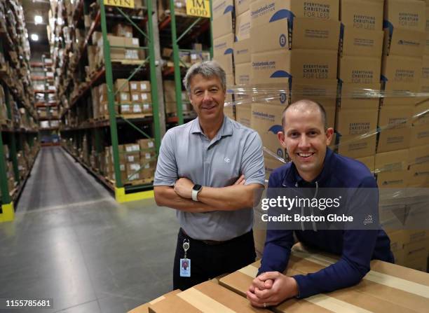 Ray Hendrickson, left, owner of Christian Book Distributors, poses for a portrait with his son Kevin Hendrickson, who also works at the company, in...