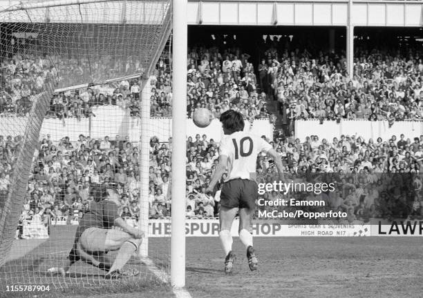 John Duncan of Tottenham Hotspur scores with a header past the stranded Coventry City goalkeeper Jim Blyth during a Football League Division One...