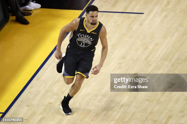 Klay Thompson of the Golden State Warriors celebrates the basket against the Toronto Raptors in the first half during Game Six of the 2019 NBA Finals...