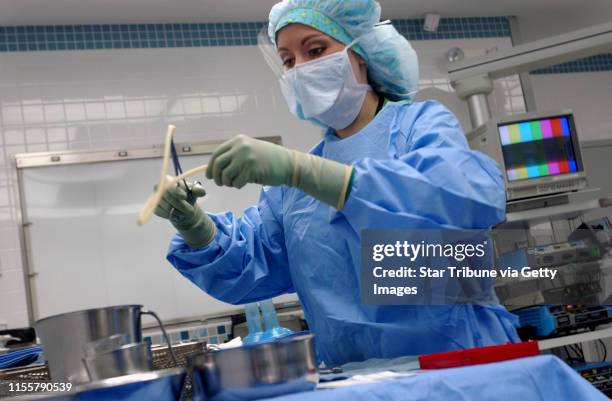 Jmcleister@startribune.com Minneapolis,Mn.,Fri.,Jan. 12, 2007--Darcy Cropper, a new surgical tech at Abbott Northwestern, sets up one of the...