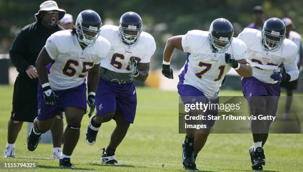 Jgholt@startribune.com 7/29/2007---Vikings defensive line coach Karl Dunbar leads the line through drills Sunday afternoon in Mankato.