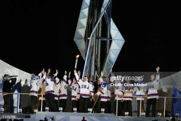 Mike Eruzione, captain of the 1980 'Miracle on Ice' US Hockey Team and the rest of the gold medal hockey squad prepare to light the Olympic Cauldron...