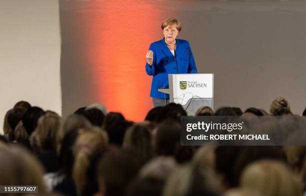 German Chancellor Angela Merkel speaks during a women's network meeting at the Albertinum museum in Dresden, eastern Germany, one and a half months...