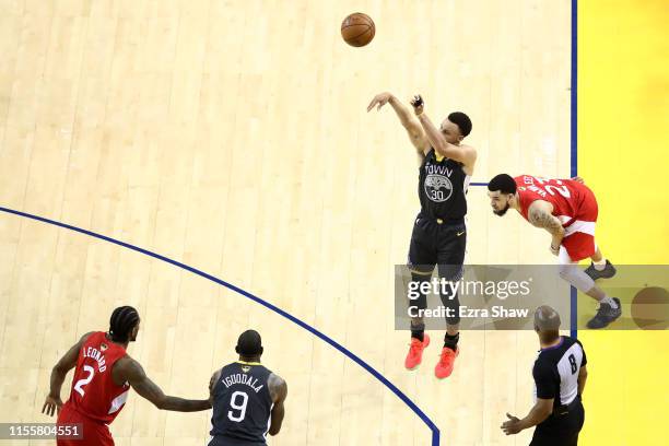 Stephen Curry of the Golden State Warriors attempts a jump shot against the Toronto Raptors in the second half during Game Six of the 2019 NBA Finals...