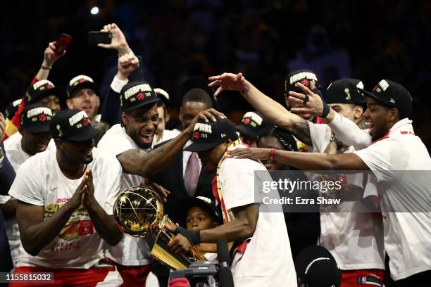 The Toronto Raptors celebrate with the Larry O'Brien Championship Trophy after defeating the Golden State Warriors to win Game Six of the 2019 NBA...