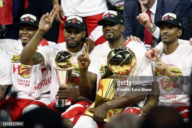 The Toronto Raptors celebrate with the Larry O'Brien Championship Trophy after their team defeated the Golden State Warriors to win Game Six of the...
