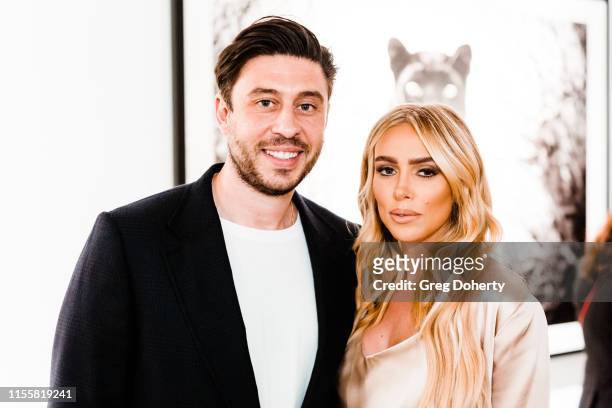 Sam Palmer and Petra Ecclestone attend the Maddox Gallery Los Angeles Presents: "The Disrupters" by David Yarrow on June 13, 2019 in West Hollywood,...