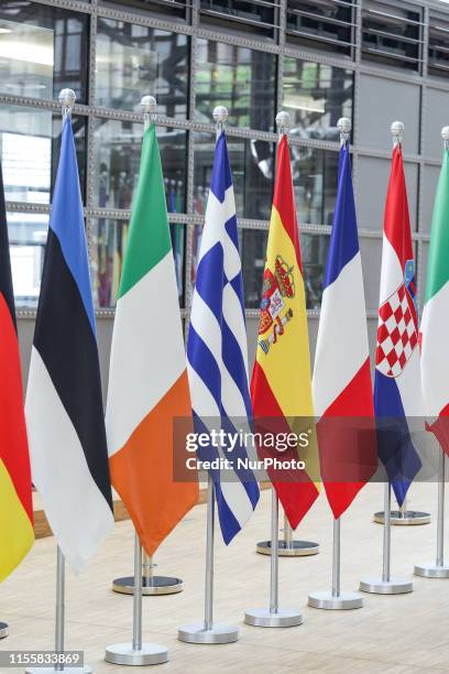 Flags and flags of the European countries state member next to the red carpet where EU leaders arrive in the EU in the European Council building...