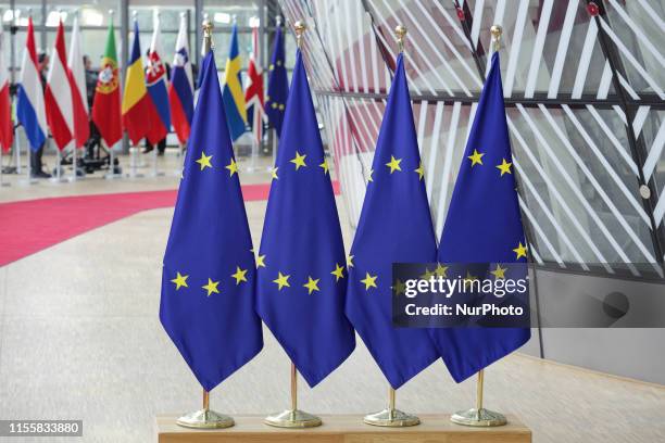 Flags and flags of the European countries state member next to the red carpet where EU leaders arrive in the EU in the European Council building...