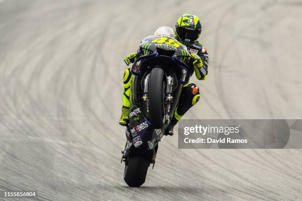 Valentino Rossi of Italy and Monster Energy Yamaha MotoGP pulls a wheelie after the first MotoGP free practice session ahead of MotoGP Gran Premi...