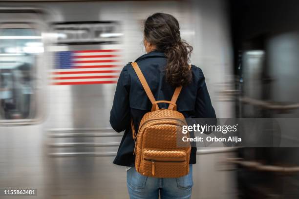 woman waiting for subway - underground walkway stock pictures, royalty-free photos & images