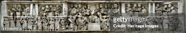 Constantine distributing money to the people . Detail of the Arch of Constantine, 312-315. Artist Classical Antiquities.