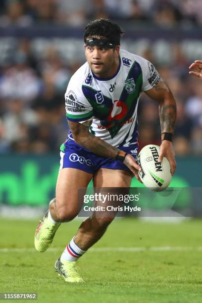 Issac Luke of the Warriors passes during the round 14 NRL match between the Gold Coast Titans and the New Zealand Warriors at Cbus Super Stadium on...