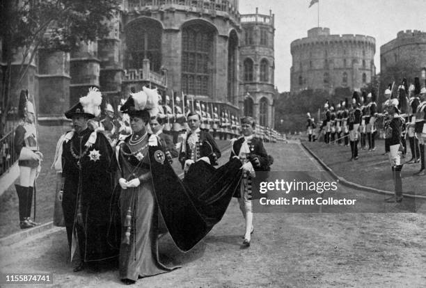 King George V and Queen Mary in the Garter Procession at Windsor, 1913', . George V and Mary of Teck of the United Kingdom, walking in procession at...