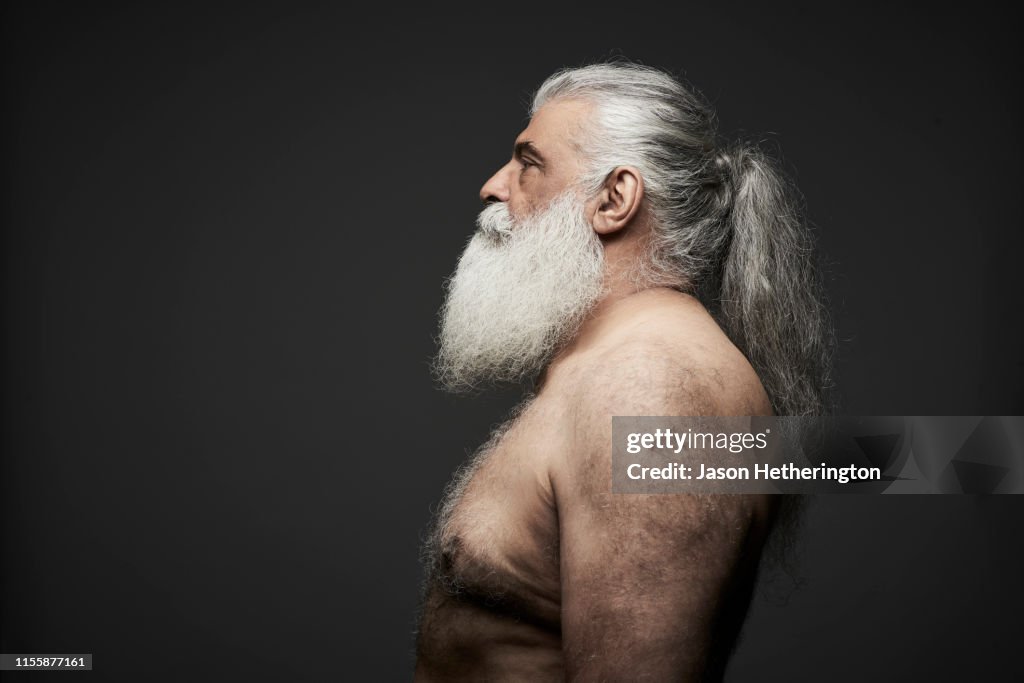 A Senior Man In Profile Bare Chested With A White Beard And Long Grey Hair  Tied Back High-Res Stock Photo - Getty Images