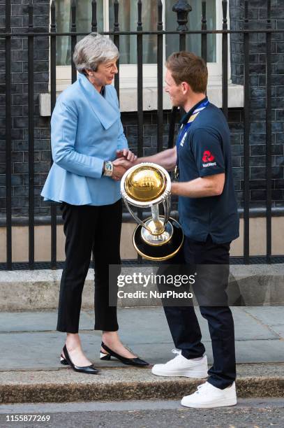 Prime Minister Theresa May greets the England Mens Cricket team captain Eoin Morgan outside 10 Downing Street as the team arrives to celebrate their...