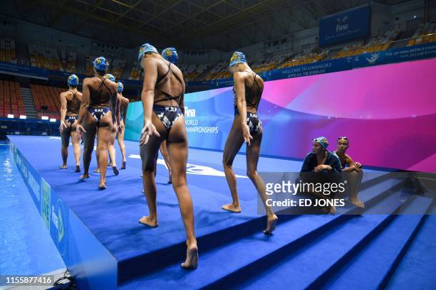 Members of Kazakhstan's team gather during the artistic swimming event during the 2019 World Championships at Yeomju Gymnasium in Gwangju on July 16,...
