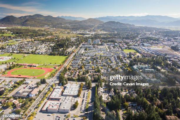 aerial view of the city of abbotsford, rotary stadium, sumas mountain - abbotsford canada stock pictures, royalty-free photos & images