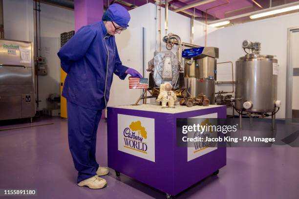 Cadbury World chocolatier Dawn Jenks adds the finishing touches to the chocolate recreation of the Apollo 11 moon landing at Cadbury World in...