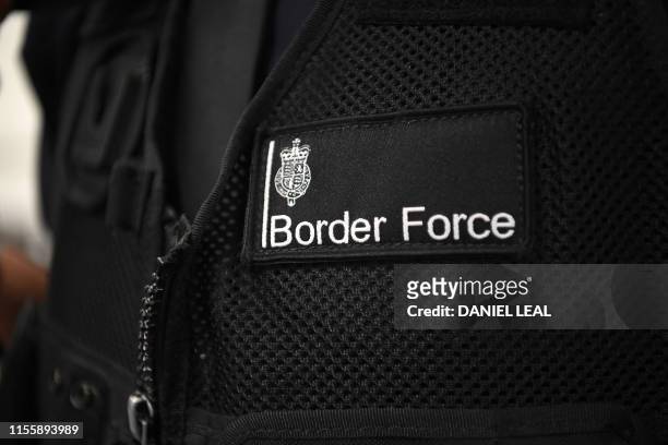 Member UK Border Force patrols at Heathrow Airport in London on July 16 part of Operation Limelight, a national multi-agency safeguarding operation...