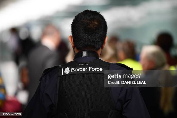 Member UK Border Force patrols at Heathrow Airport in London on July 16 part of Operation Limelight, a national multi-agency safeguarding operation...